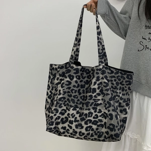 Detailed texture of leopard print corduroy tote bag with large capacity for women