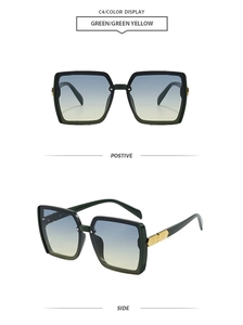 Detail of square sunglasses with green frame, gradient lenses, and gold metal accents