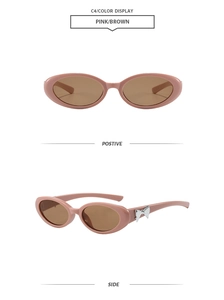 Détail de lunettes de soleil œil-de-chat ovales roses avec nœud métallique argenté
