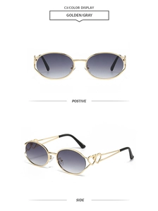 Detail of Y2K oval sunglasses with golden metal frames and hollow double heart decor