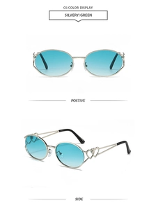 Detail view of oval Y2K sunglasses with silver metal frame and hollow heart decor