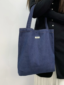 Large dark blue denim tote bag with ATRYG brand label for casual daily shoulder carry