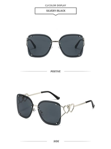 Detail of rimless square sunglasses with silver double heart hollow metal temple design