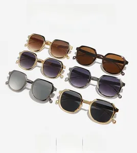 Detail of trendy hexagonal sunglasses showing six diverse colors and metal hinge accents