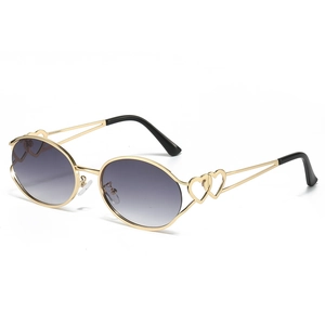 Y2K oval sunglasses with gold metal frame featuring hollow heart temple decorations