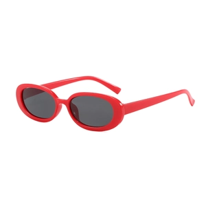 Classic red oval frame sunglasses with black lenses in a 90s vintage retro style