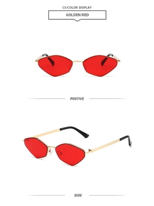 Detail view of golden irregular geometric metal frames with vibrant red lenses
