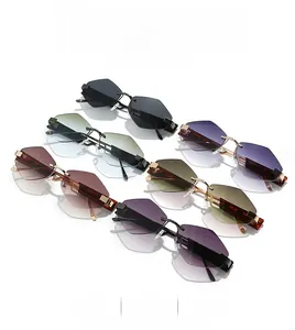 Detail view of colorful rimless diamond-cut sunglasses with slim metal temples