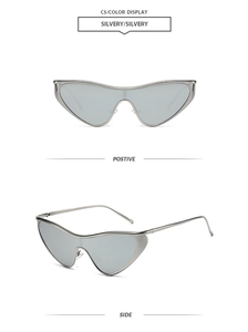 Close-up of futuristic silver punk sunglasses with one-piece wrap lens and metal frame