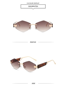 Detail view of rimless diamond cut hexagon sunglasses with brown gradient lenses
