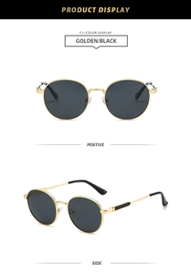 Detailed close-up of retro oval sunglasses with golden metal frames and black lenses