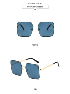 Detail view of square gold frame sunglasses with dark blue lenses and slim metal temples