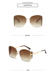 Details einer übergroßen Schmetterlings-Sonnenbrille aus Gold mit braunem Verlauf