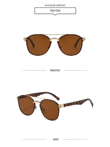 Detailansicht der ovalen Doppelbrücken-Sonnenbrille mit Leopardenmuster-Bügeln
