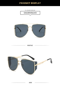 Detail of golden aviator sunglasses with double bridge and side shield design