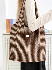 Large autumn wool tote bag with coffee herringbone pattern and wide shoulder strap