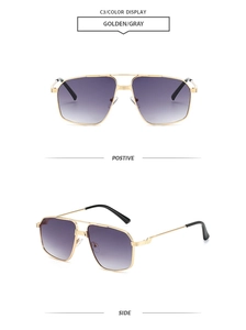 Detail of pilot sunglasses with gold metal double bridge and grey gradient lenses