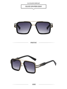 Detail of square black and gold sunglasses with gradient grey lenses and metal temples