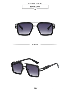 Detail of square black sunglasses featuring a double bridge and oval metal temple accents