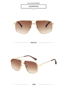 Detail of vintage aviator sunglasses with gold metal double bridge and gradient tea lenses
