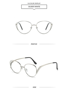 Detail of silver oversized sunglasses frame with diamond-encrusted decorative temples