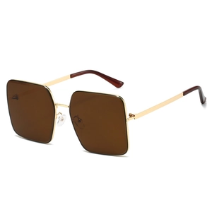 Classic oversized square sunglasses with gold metal frames and brown gradient lenses