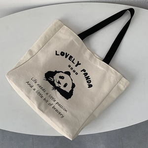 Minimalist canvas tote bag featuring a cute panda print and black shoulder straps
