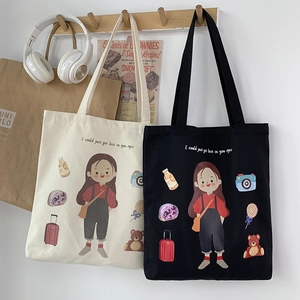 Detail of canvas tote bag with hand-drawn girl illustration and creative typography