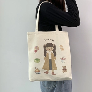 Detail of canvas shoulder bag with cute cartoon girl and dessert illustration prints