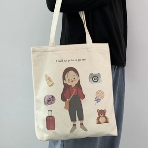Detail of canvas tote bag with girl illustration and romantic text print