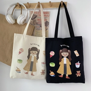 Detail of canvas tote bags with cute girl illustration and "You are cute as a button" text