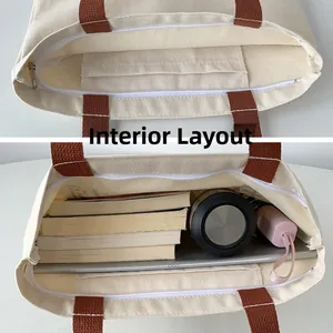 Detail view of large canvas tote bag internal structure with zipper pocket and compartments