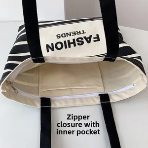 Macro detail of canvas tote bag interior showing zipper closure and inner pocket