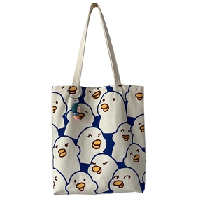 Cute white canvas tote bag with cartoon duck patterns and a small girl doll pendant