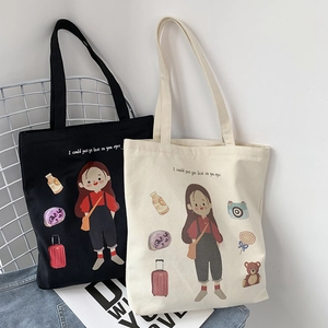 Detail of canvas tote bags in black and beige with illustrated cartoon girl and snacks