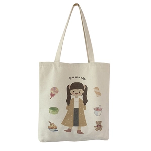 Cute white canvas tote bag with girl cartoon illustration and sweet macaron patterns