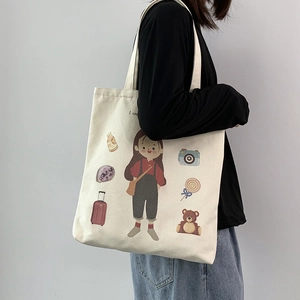 White canvas tote bag with illustrated cartoon girl and cute graphic elements for daily use