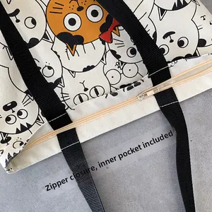 Detail of canvas tote bag showing the metal zipper closure and interior functional pocket