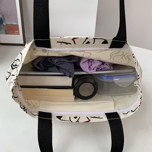 Top view of large canvas tote bag showing interior space with zipper and inner pocket