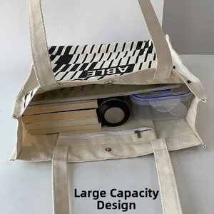 Internal view of the beige canvas tote bag showing large capacity and zipper pocket