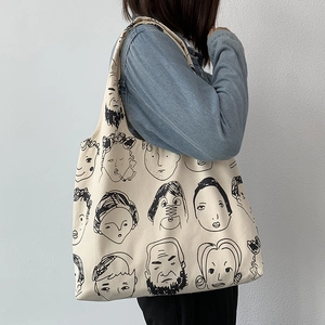 Detailed view of heavy canvas tote bag with artistic line art portrait illustration