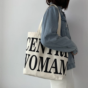 Detail of Century Woman letter print on cream white canvas tote bag for women