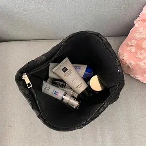 Large capacity black quilted cosmetic bag for women showing spacious interior and items