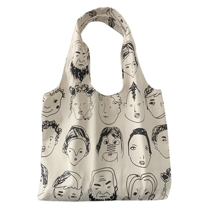 Artistic tote bag with black minimalist portrait sketches on cream canvas fabric