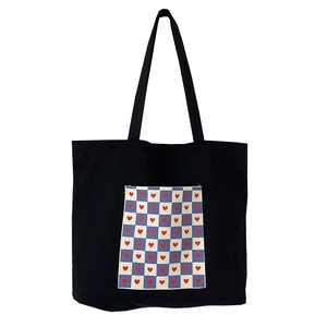 Large black canvas tote bag with a blue checkered heart pocket for women