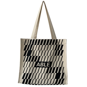 Large beige canvas tote bag with ABLE geometric pattern for commuting and students