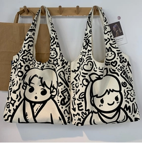 Detail of canvas tote bag featuring cute cartoon boy and girl doodle illustration