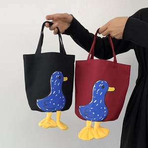 Japanese style canvas lunch bags with duck prints and yellow hanging feet charms