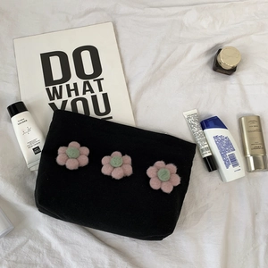 Portable black canvas makeup bag with 3D pink floral decor for travel organization