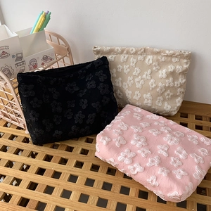 Three-piece floral jacquard makeup bags with 3D embossed texture and zip closure